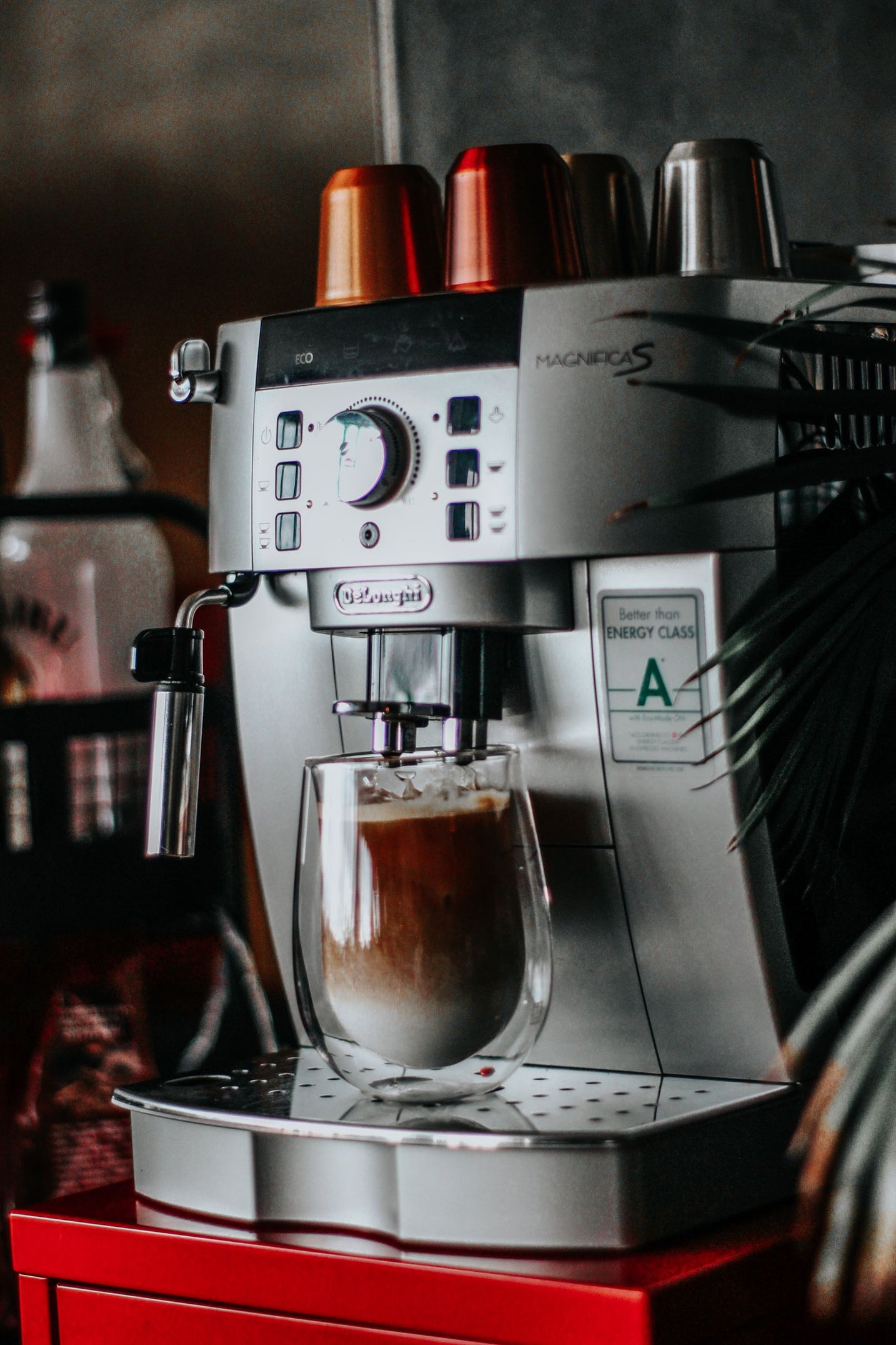Compact espresso machine brewing a morning shot at home