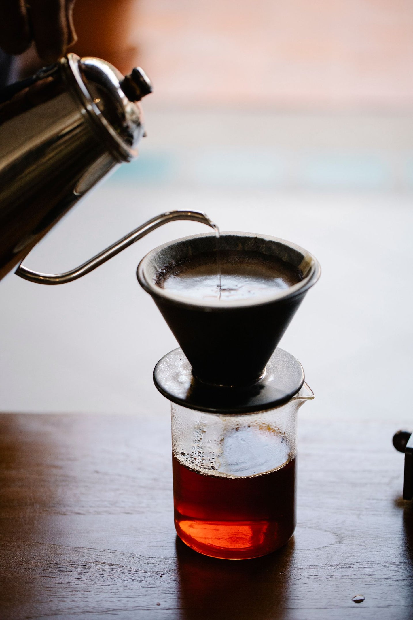 Moody close-up of a manual pour over brew in progress