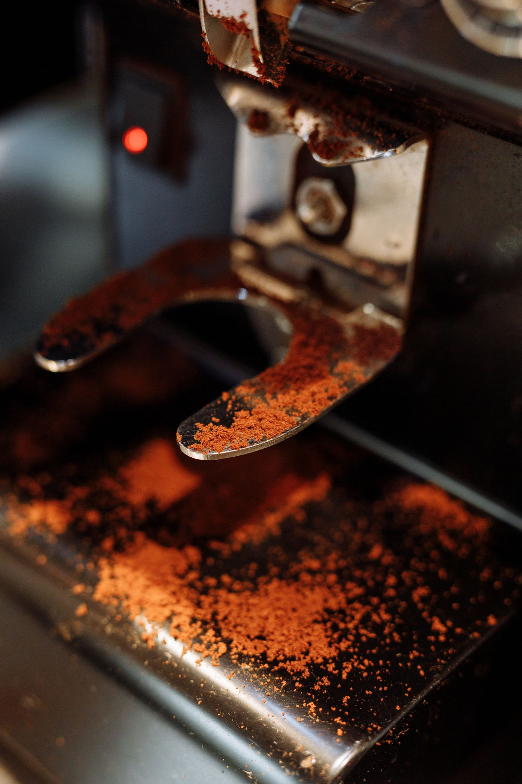 Espresso machine with scattered grounds awaiting a deep clean